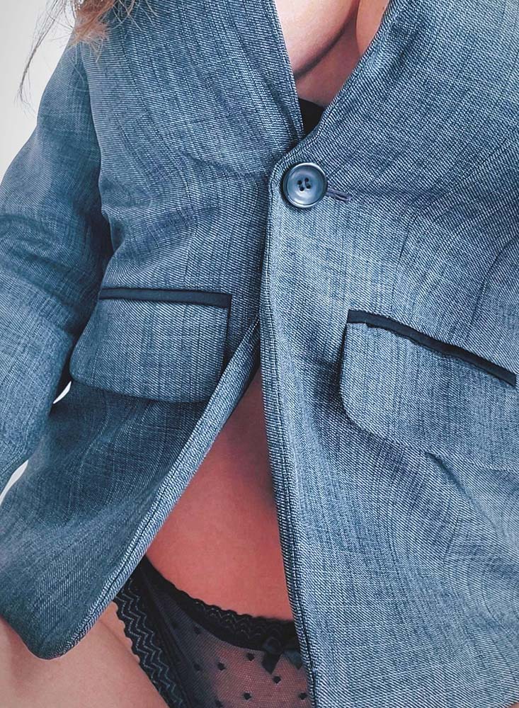 Nottingham escort wearing black underwear and a blue blazer