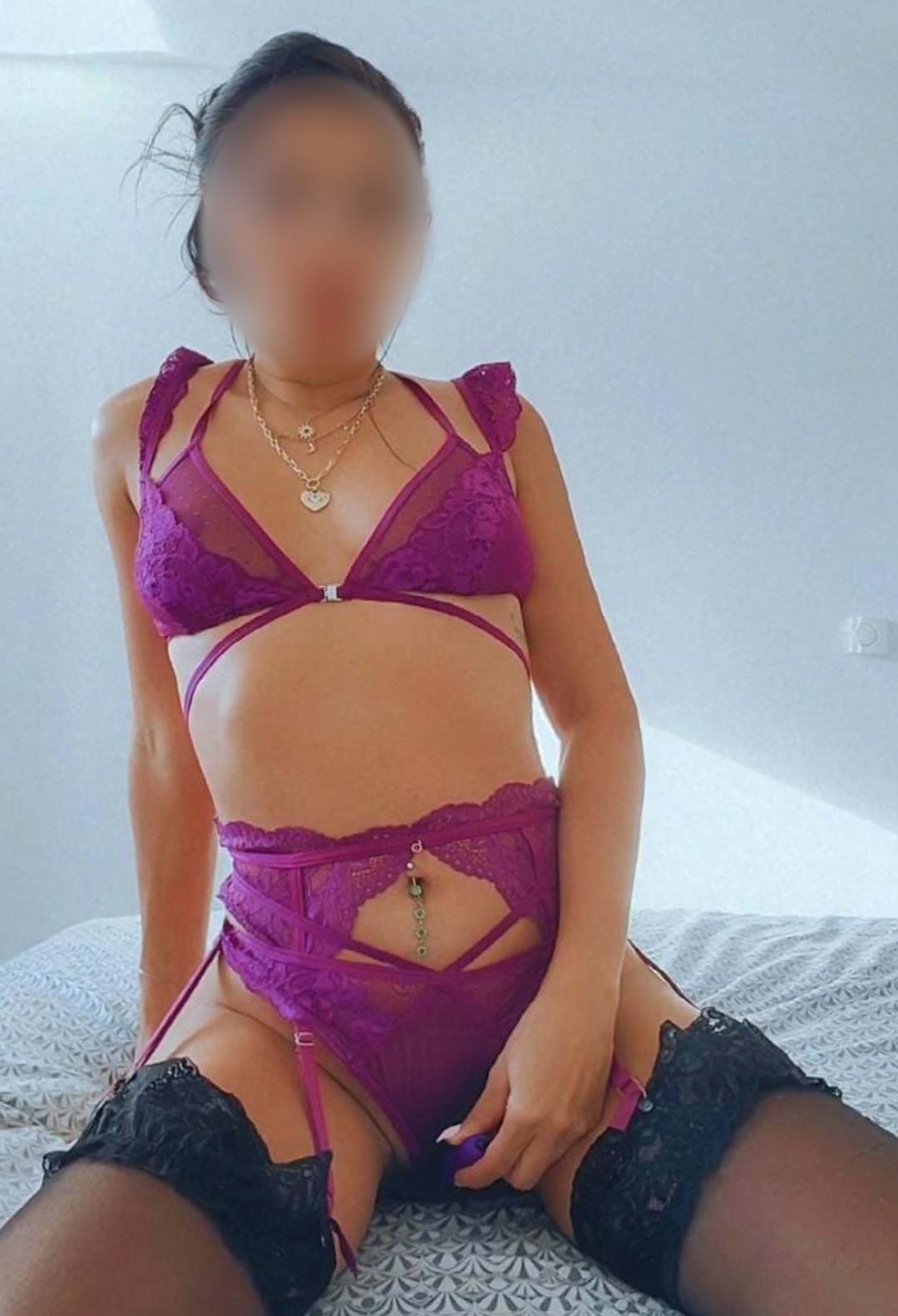 Brazilian escort wearing pink lingerie
